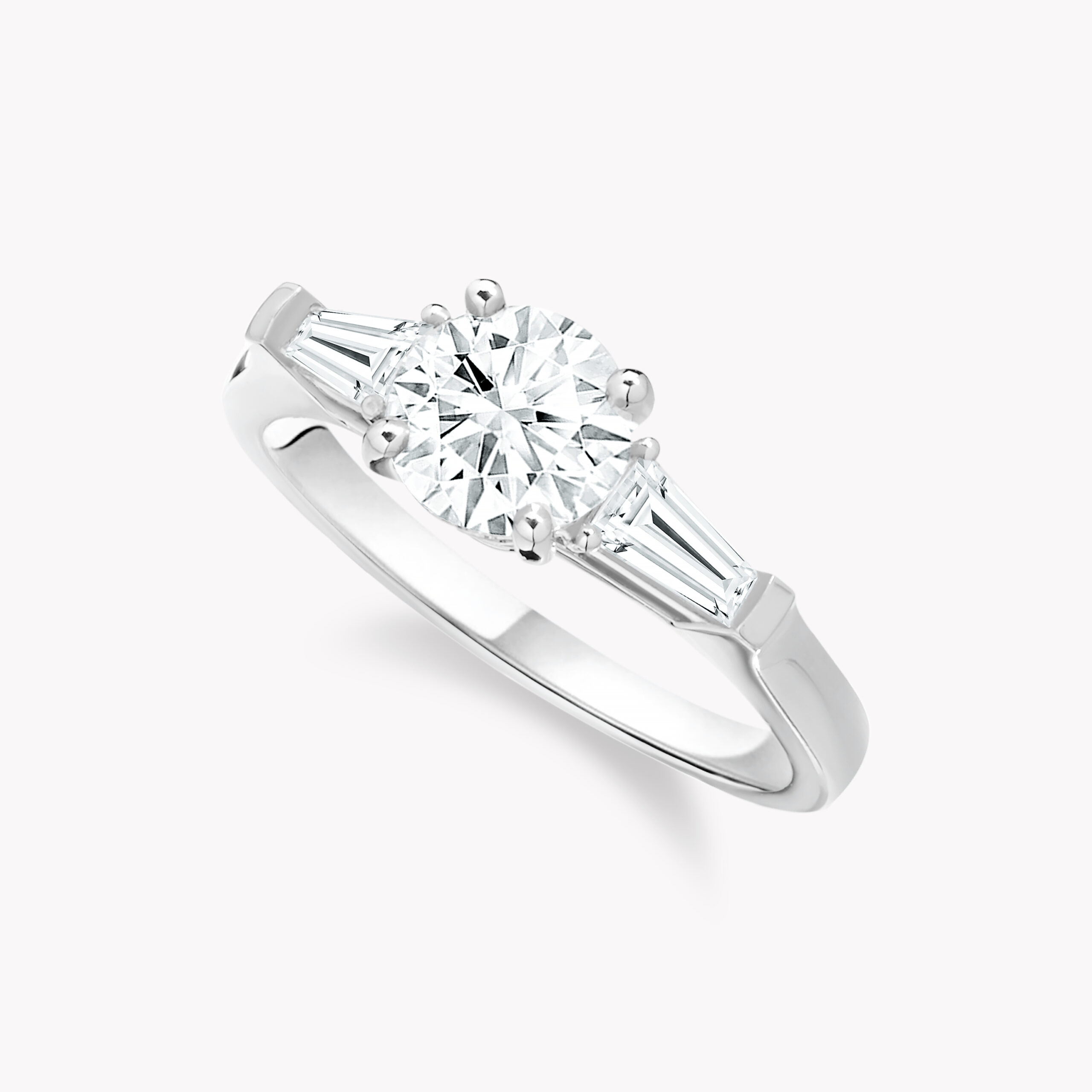 Round - Cut Diamond  Ring with Tapered Baguette Side Diamonds